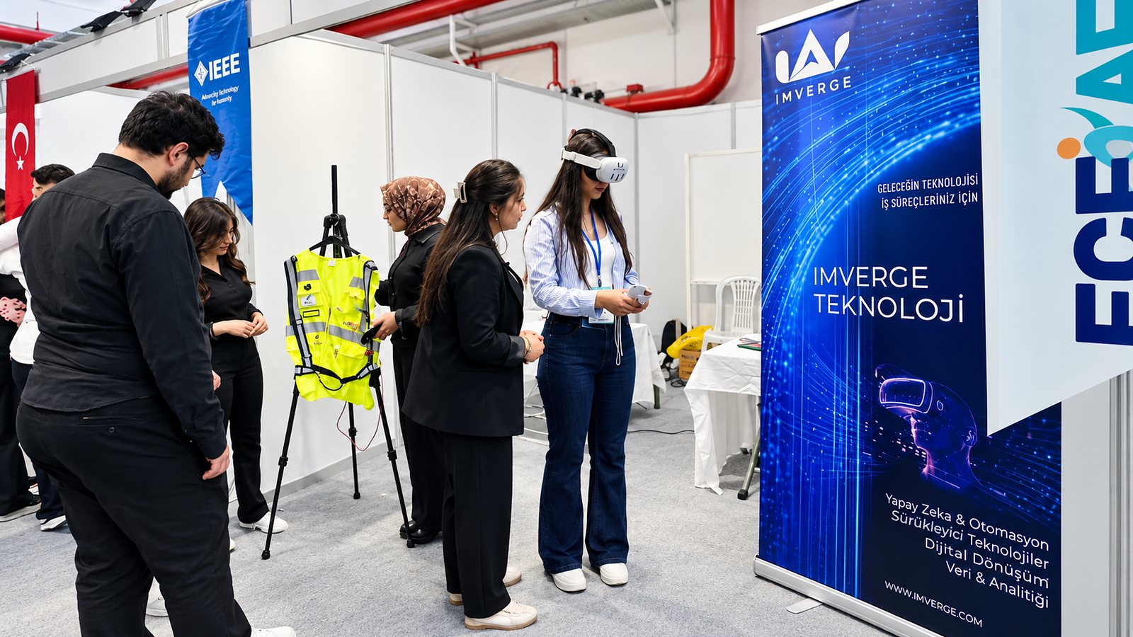 A visitor trying a VR OHS training scenario at the Imverge stand at EGEKAF’26.