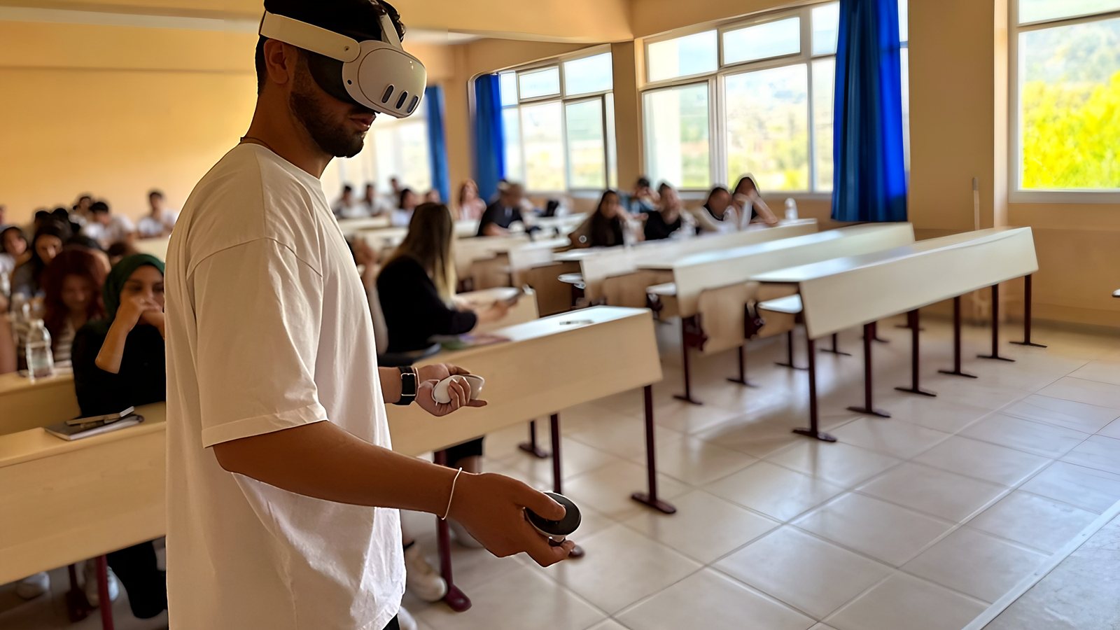An OHS student trying an Imverge simulation in a VR headset in a classroom, with other students following the lesson behind him.